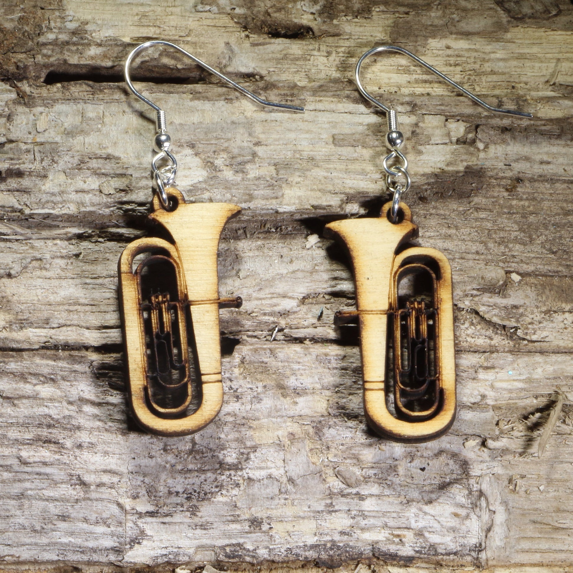 Hand-painted wooden tuba dangle earrings featuring detailed concert tubas with engraved brass instrument accents on hypoallergenic .925 sterling silver hooks. Lightweight music jewelry for tuba players, band directors, marching band members, orchestra musicians, music teachers, and brass instrument enthusiasts.