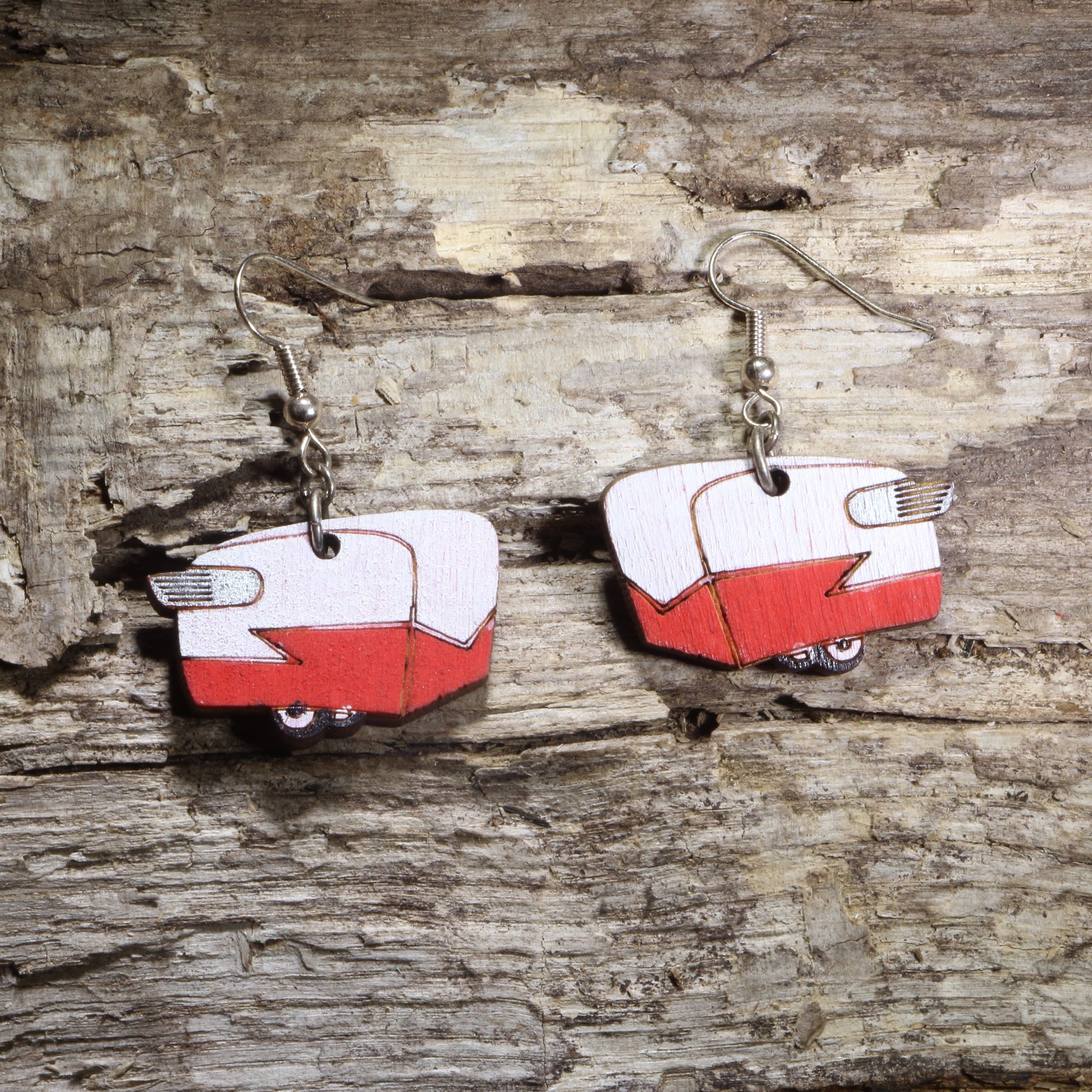 Hand-painted wooden vintage camper trailer dangle earrings featuring a retro red and white travel trailer on hypoallergenic .925 sterling silver hooks. Lightweight camping-inspired jewelry for RV owners, vintage camper enthusiasts, road trip lovers, glamping fans, and outdoor adventure gifts.