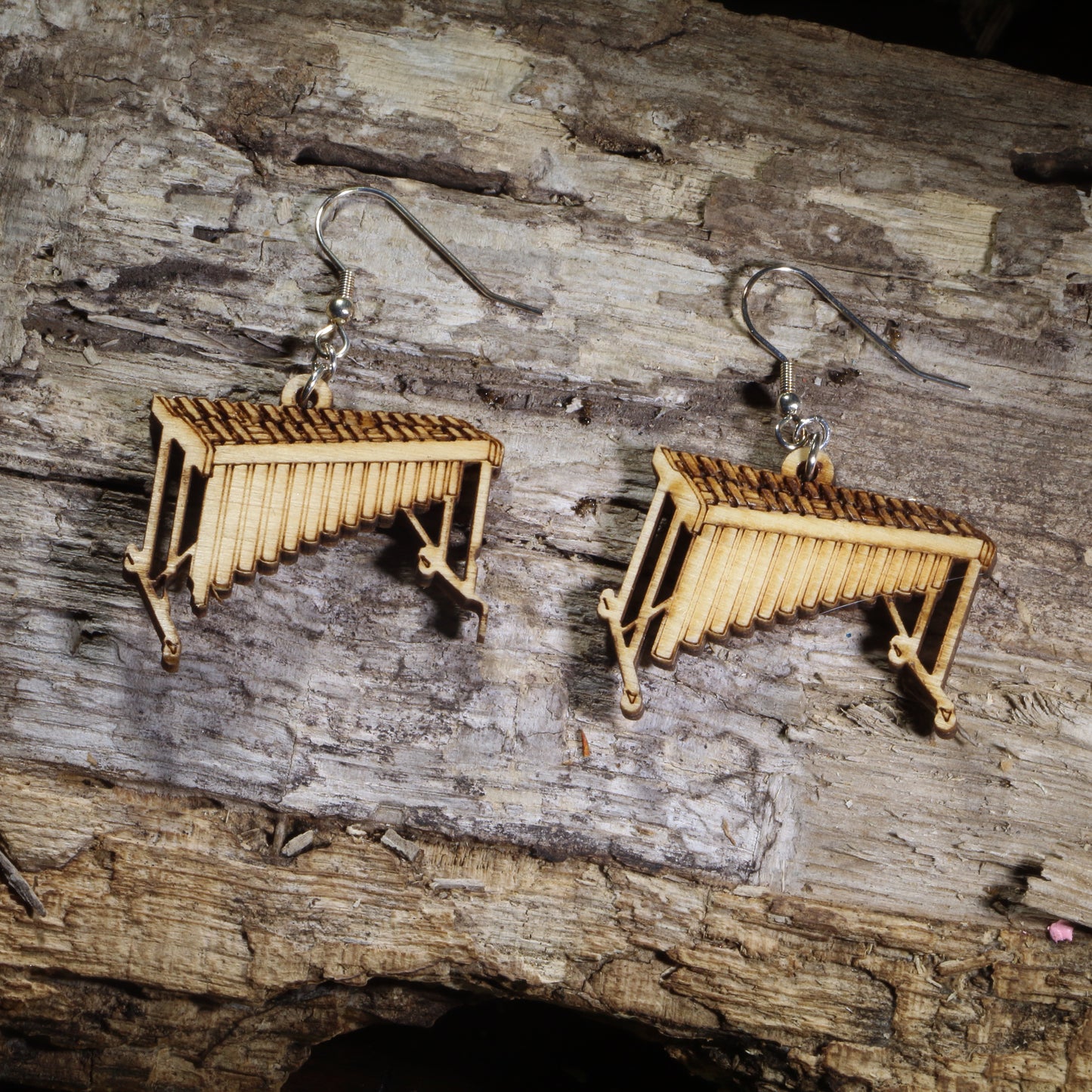Hand-painted wooden marimba dangle earrings featuring detailed concert marimbas on hypoallergenic .925 sterling silver hooks. Lightweight percussion-inspired jewelry for marimba players, percussionists, band directors, music teachers, orchestra musicians, and music lovers.