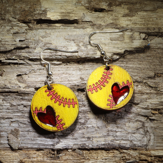 Hand-painted yellow softball wooden dangle earrings with red stitching and resin heart accents, sports jewelry for softball players and fans