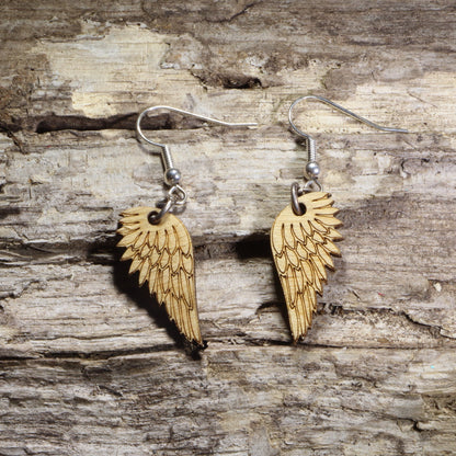 Handcrafted Angel Wing wooden dangle earrings featuring intricately engraved feathered wings. Lightweight laser-cut wooden earrings with hypoallergenic .925 sterling silver hooks, perfect for angel lovers, memorial gifts, spiritual jewelry, faith-inspired accessories, celestial fashion, and everyday wear.