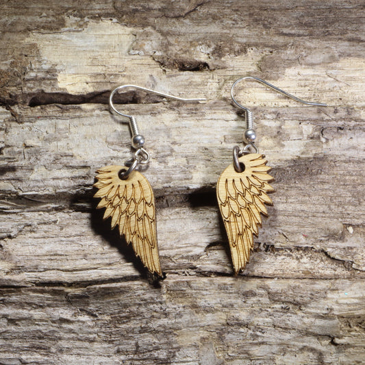 Handcrafted Angel Wing wooden dangle earrings featuring intricately engraved feathered wings. Lightweight laser-cut wooden earrings with hypoallergenic .925 sterling silver hooks, perfect for angel lovers, memorial gifts, spiritual jewelry, faith-inspired accessories, celestial fashion, and everyday wear.