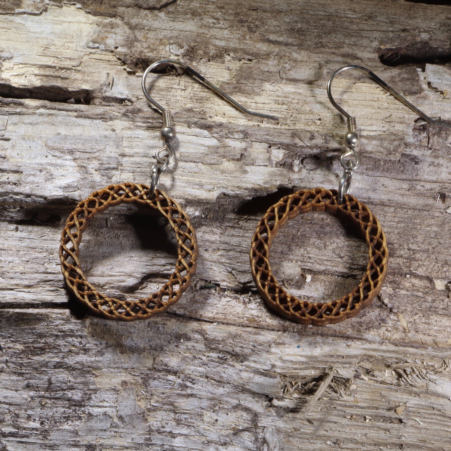 Handcrafted Celtic Knot Circle wooden dangle earrings featuring an intricate circular Celtic knot design symbolizing eternity and interconnectedness. Lightweight laser-cut wooden earrings with hypoallergenic .925 sterling silver hooks, perfect for Celtic jewelry lovers, Irish heritage, pagan traditions, spiritual accessories, and timeless everyday wear.