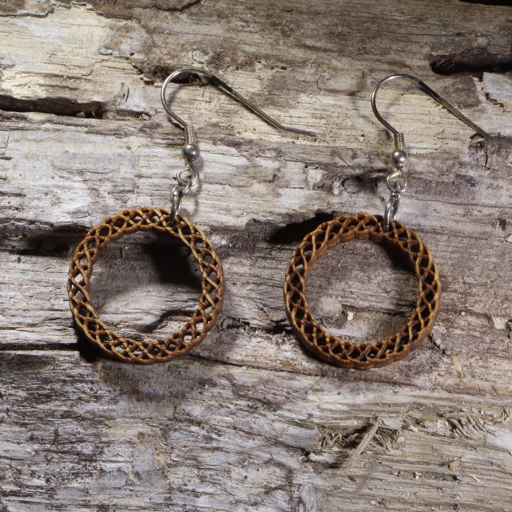 Handcrafted Celtic Knot Circle wooden dangle earrings featuring an intricate circular Celtic knot design symbolizing eternity and interconnectedness. Lightweight laser-cut wooden earrings with hypoallergenic .925 sterling silver hooks, perfect for Celtic jewelry lovers, Irish heritage, pagan traditions, spiritual accessories, and timeless everyday wear.