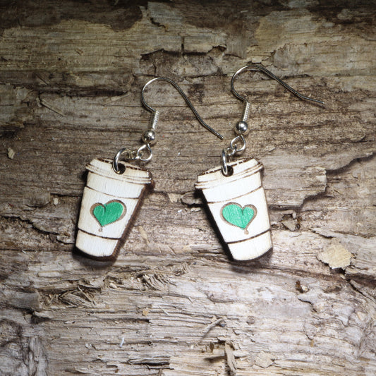 Handcrafted coffee cup wooden dangle earrings featuring a charming green heart design. Lightweight hand-painted wooden earrings with hypoallergenic .925 sterling silver hooks, perfect for coffee lovers, baristas, café enthusiasts, espresso fans, tea drinkers, and anyone who can't start the day without their favorite cup.