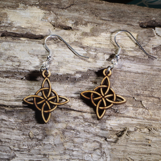 Handmade Celtic knot wooden dangle earrings featuring an intricate endless Celtic knot design. Lightweight Irish-inspired earrings crafted from wood with hypoallergenic .925 sterling silver hooks, perfect for Celtic heritage, Irish culture, pagan traditions, Celtic festivals, and lovers of timeless knotwork jewelry.