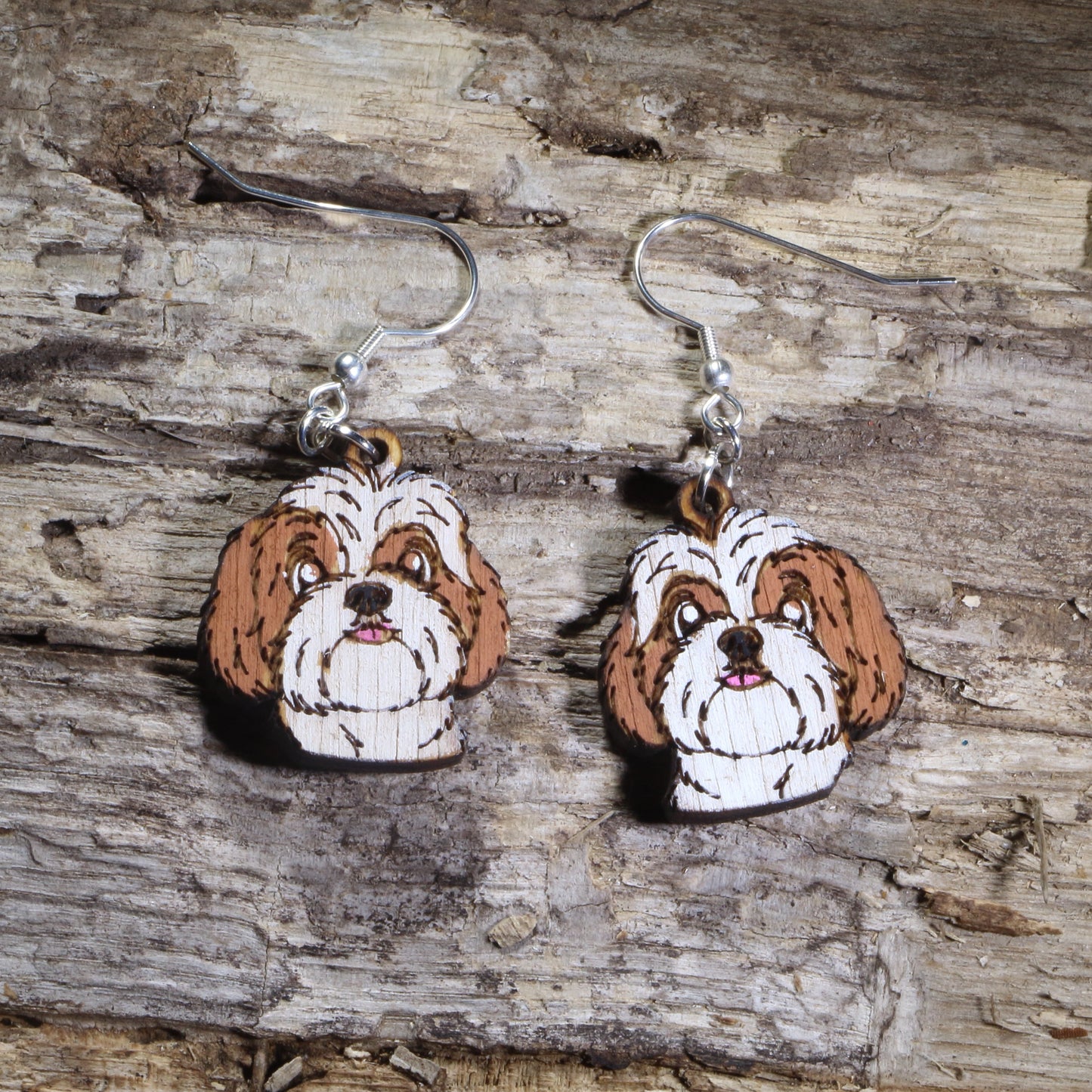 Handmade Shih Tzu wooden dangle earrings featuring adorable hand-painted Shih Tzu dogs with detailed facial features. Lightweight dog lover earrings crafted from wood with hypoallergenic .925 sterling silver hooks, perfect for Shih Tzu owners, pet parents, dog lovers, toy breed enthusiasts, and unique handmade animal jewelry.