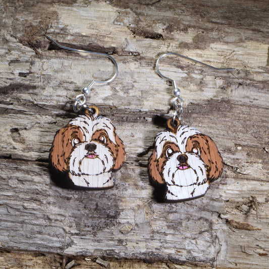 Handmade Shih Tzu wooden dangle earrings featuring adorable hand-painted Shih Tzu dogs with detailed facial features. Lightweight dog lover earrings crafted from wood with hypoallergenic .925 sterling silver hooks, perfect for Shih Tzu owners, pet parents, dog lovers, toy breed enthusiasts, and unique handmade animal jewelry.