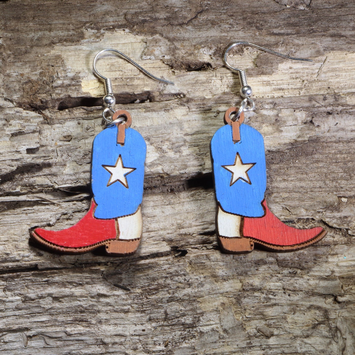 Handmade Texas Lone Star cowboy boot wooden dangle earrings featuring classic western boots with a bold Lone Star design. Lightweight Texas earrings crafted from wood with hypoallergenic .925 sterling silver hooks, perfect for Texas pride, western fashion, country music fans, rodeo enthusiasts, cowgirls, and unique cowboy jewelry collectors.