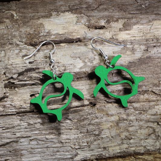 Handmade green tribal sea turtle wooden dangle earrings crafted from lightweight laser-cut wood with hypoallergenic .925 sterling silver hooks. Hawaiian-inspired ocean wildlife jewelry perfect for sea turtle lovers, beach enthusiasts, marine life fans, coastal style, and tropical gifts.