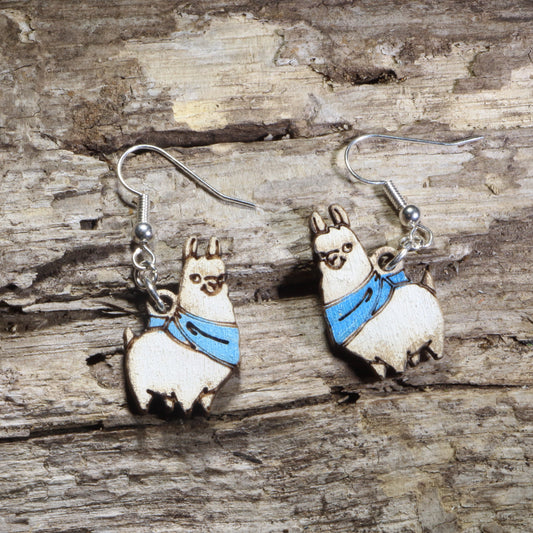 Handmade llama wooden dangle earrings featuring adorable white llamas wearing bright blue scarves. Lightweight llama earrings crafted from wood with hypoallergenic .925 sterling silver hooks, perfect for llama lovers, alpaca enthusiasts, farm animal fans, whimsical jewelry collectors, and unique animal gift ideas.