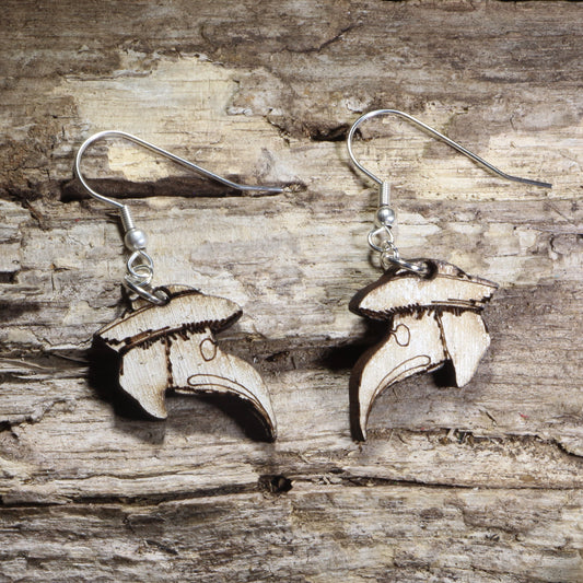 Handmade wooden plague doctor mask dangle earrings featuring the iconic beaked plague doctor mask with a wide-brimmed hat on hypoallergenic .925 sterling silver hooks. Lightweight gothic-inspired jewelry for horror fans, dark academia, Halloween, historical costume enthusiasts, and lovers of spooky accessories.
