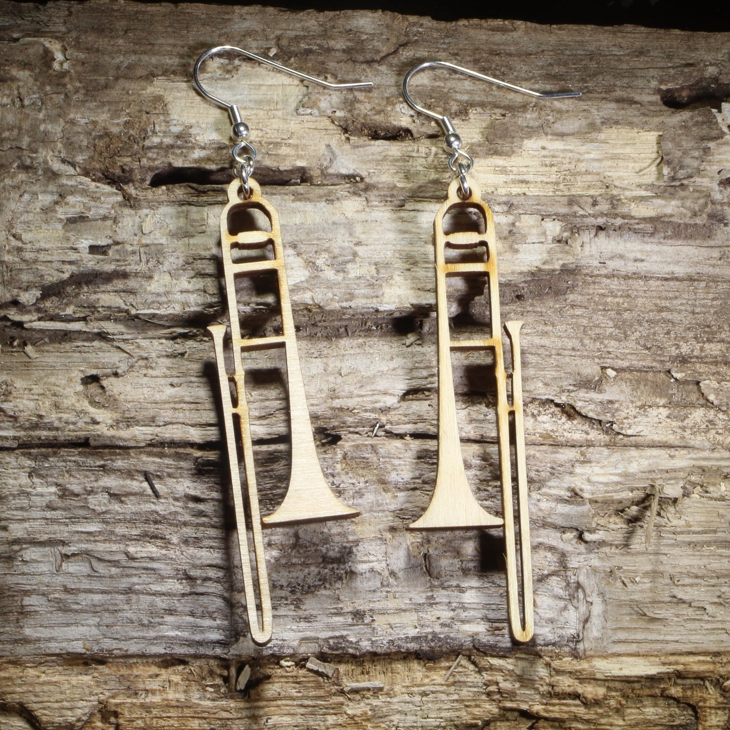 Handmade wooden trombone dangle earrings crafted from lightweight laser-cut wood with hypoallergenic .925 sterling silver hooks. Detailed brass instrument earrings make a perfect gift for trombone players, music teachers, orchestra musicians, jazz bands, and marching band enthusiasts.