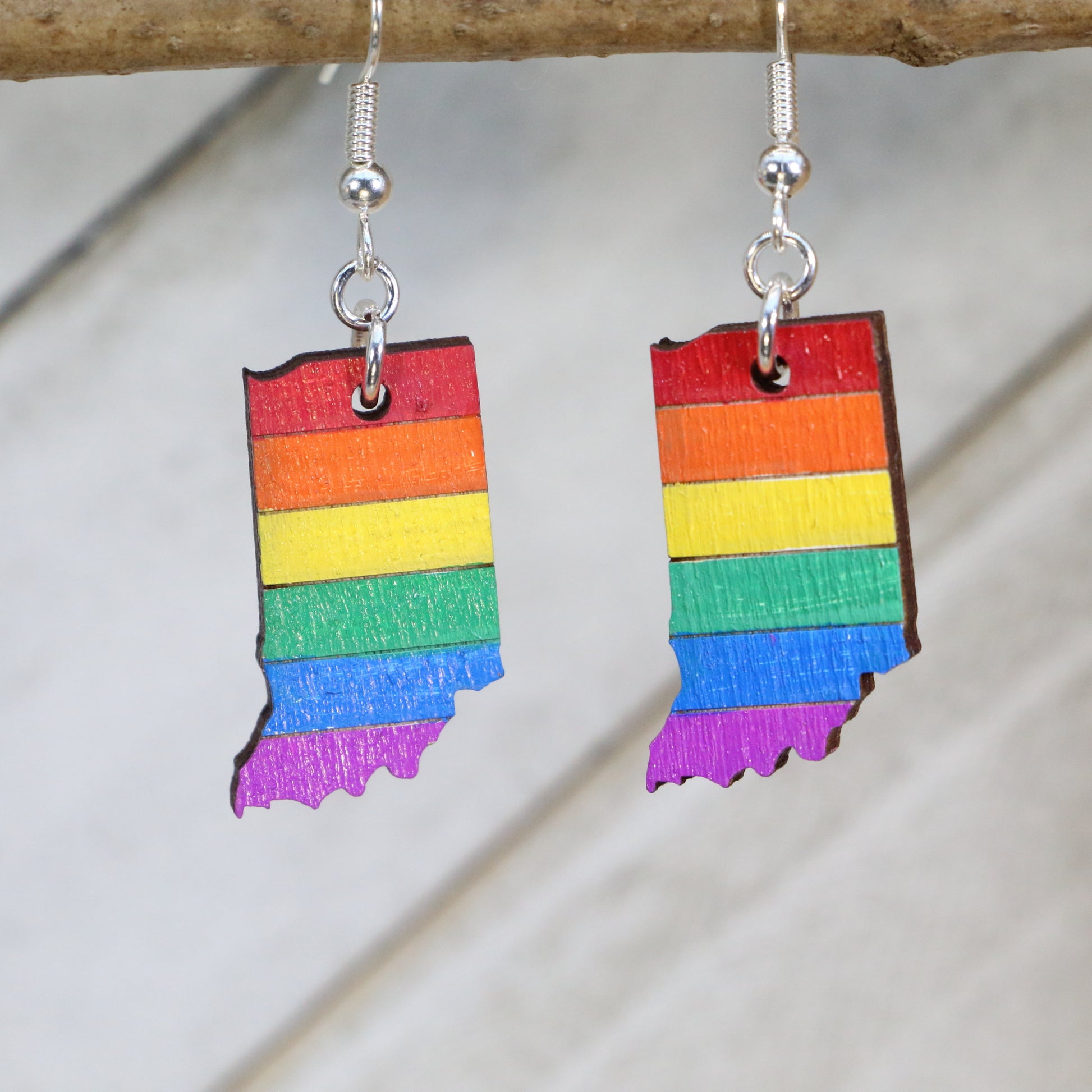 Hand-painted wooden Indiana pride flag dangle earrings with rainbow state-inspired design and hypoallergenic sterling silver hooks, lightweight LGBTQ jewelry for Indiana pride and inclusive style by Cate’s Concepts