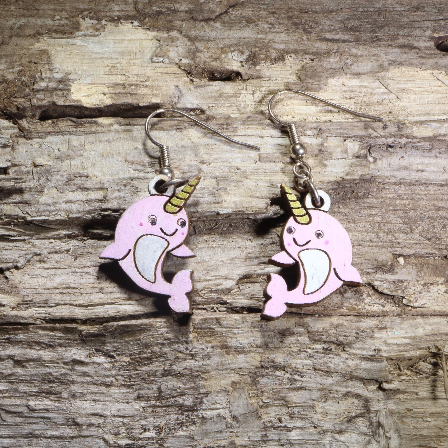 Handcrafted kawaii narwhal wooden dangle earrings featuring adorable smiling narwhals with colorful hand-painted details and signature tusks. Lightweight laser-cut wooden earrings with hypoallergenic .925 sterling silver hooks, perfect for ocean animal lovers, narwhal fans, kawaii fashion enthusiasts, marine life collectors, and cute handmade jewelry.