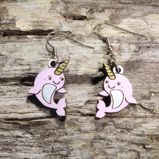 Handcrafted kawaii narwhal wooden dangle earrings featuring adorable smiling narwhals with colorful hand-painted details and signature tusks. Lightweight laser-cut wooden earrings with hypoallergenic .925 sterling silver hooks, perfect for ocean animal lovers, narwhal fans, kawaii fashion enthusiasts, marine life collectors, and cute handmade jewelry.
