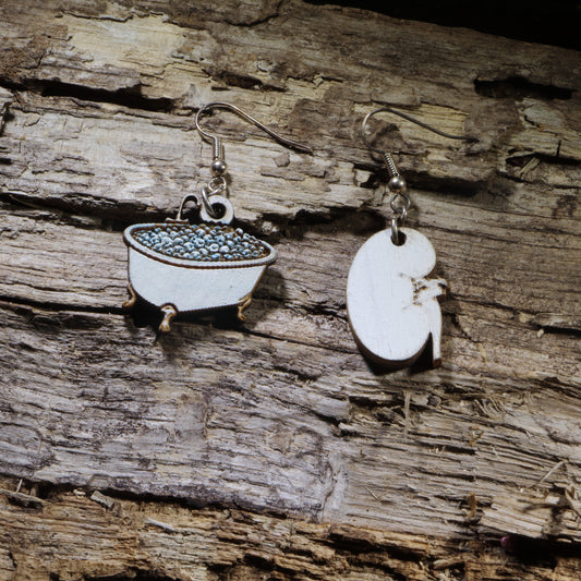 Hand-painted wooden kidney soaking in a bathtub dangle earrings on hypoallergenic .925 sterling silver hooks. Lightweight nephrology-inspired medical jewelry for nephrologists, nephrology nurses, dialysis staff, and kidney health advocates.