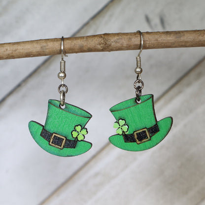 Hand-painted wooden leprechaun hat dangle earrings with festive St. Patrick’s Day design and hypoallergenic sterling silver hooks, lightweight lucky charm jewelry for Irish celebrations and holiday style by Cate’s Concepts

