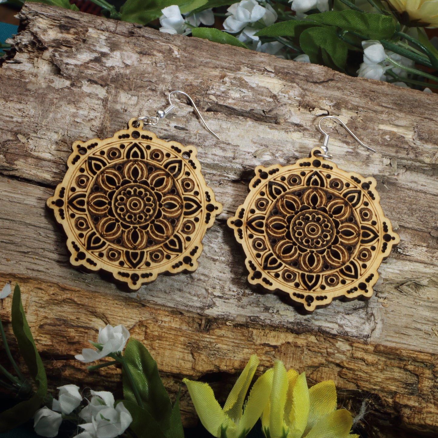 Hand-painted wooden mandala dangle earrings featuring intricate floral mandala engraving, hypoallergenic sterling silver hooks, and lightweight boho spiritual jewelry for yoga lovers, meditation enthusiasts, and free spirits by Cate's Concepts.