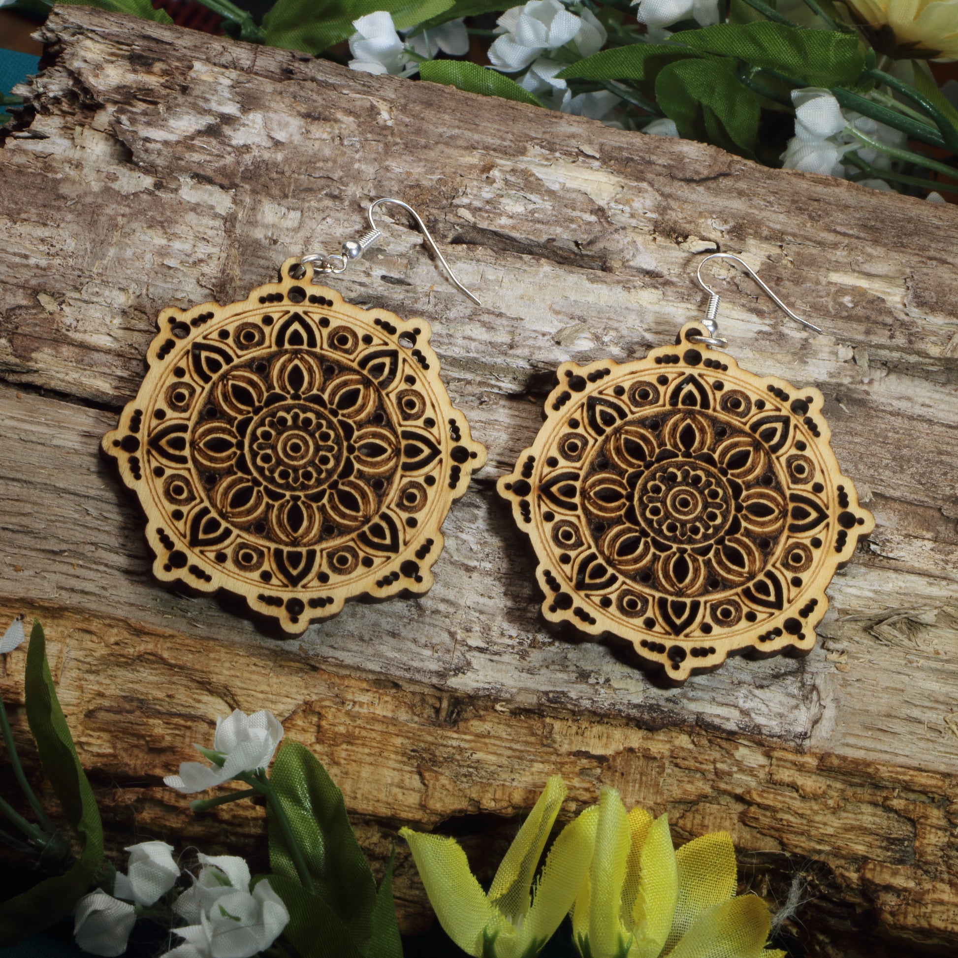 Hand-painted wooden mandala dangle earrings featuring intricate floral mandala engraving, hypoallergenic sterling silver hooks, and lightweight boho spiritual jewelry for yoga lovers, meditation enthusiasts, and free spirits by Cate's Concepts.