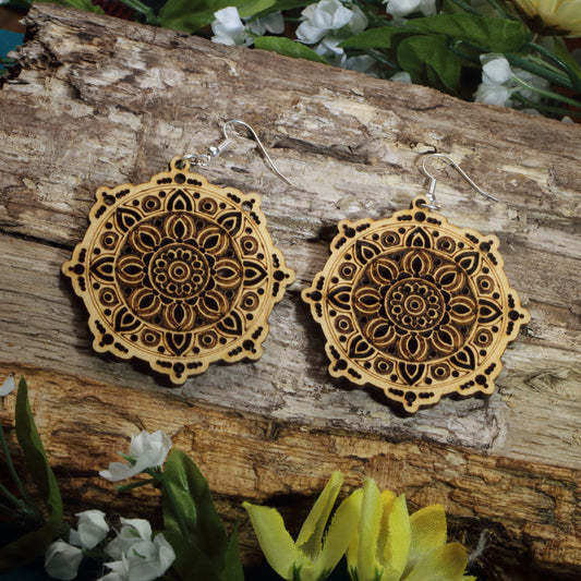 Hand-painted wooden mandala dangle earrings featuring intricate floral mandala engraving, hypoallergenic sterling silver hooks, and lightweight boho spiritual jewelry for yoga lovers, meditation enthusiasts, and free spirits by Cate's Concepts.