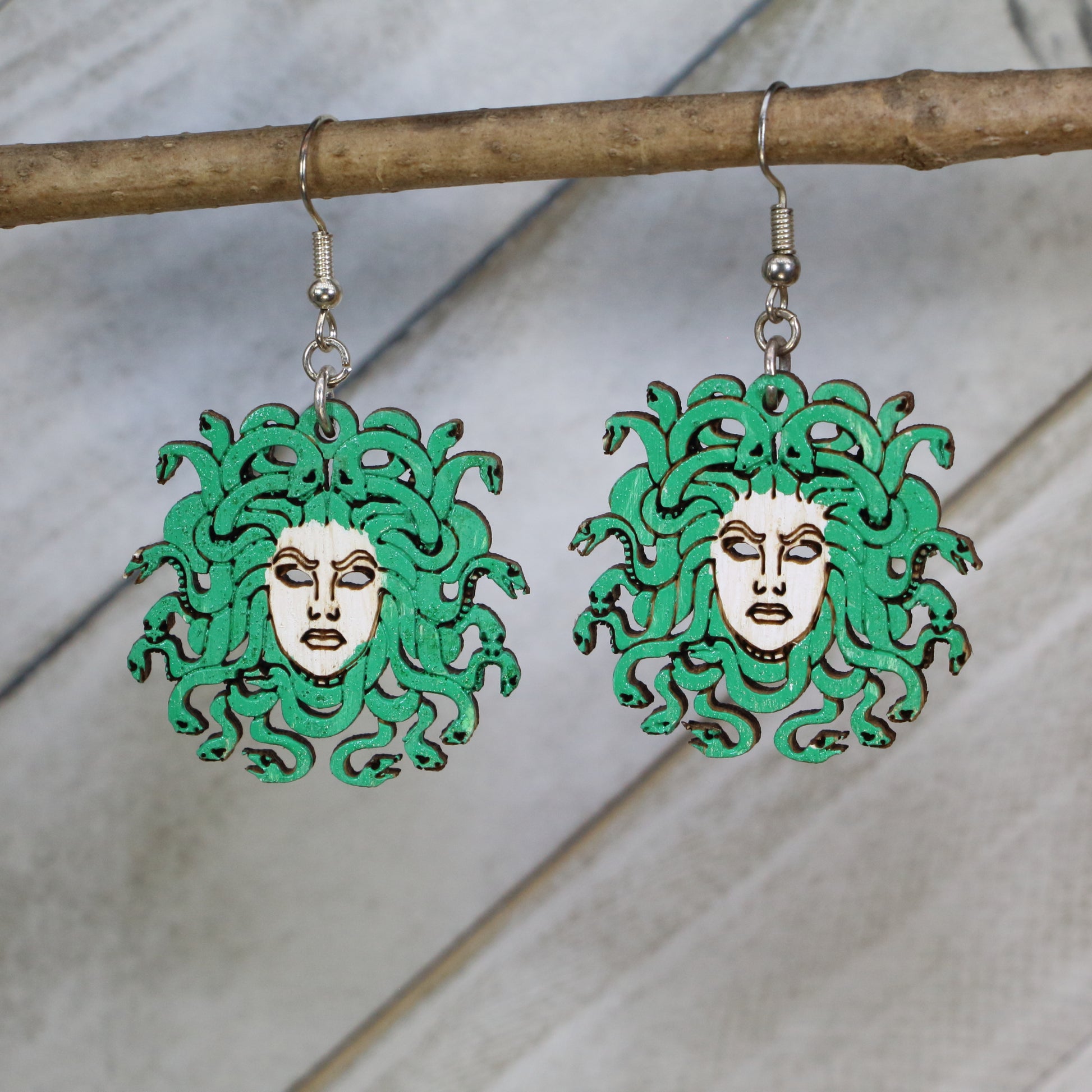 Hand-painted wooden Medusa head dangle earrings with Greek mythology gorgon design and hypoallergenic sterling silver hooks, lightweight mythology statement jewelry earrings for gothic and fantasy-inspired style