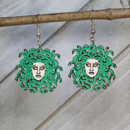 Hand-painted wooden Medusa head dangle earrings with Greek mythology gorgon design and hypoallergenic sterling silver hooks, lightweight mythology statement jewelry earrings for gothic and fantasy-inspired style