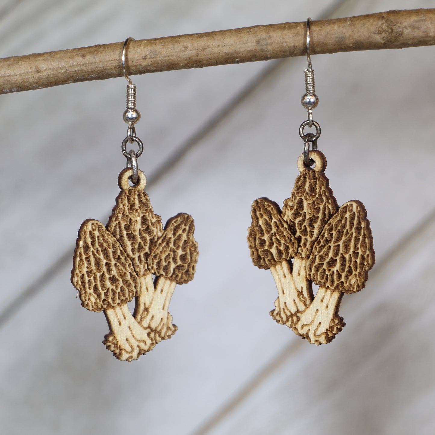 Hand-painted wooden morel mushroom dangle earrings with detailed forest forager design and hypoallergenic sterling silver hooks, nature-inspired statement jewelry earrings for mushroom hunters and outdoor lovers