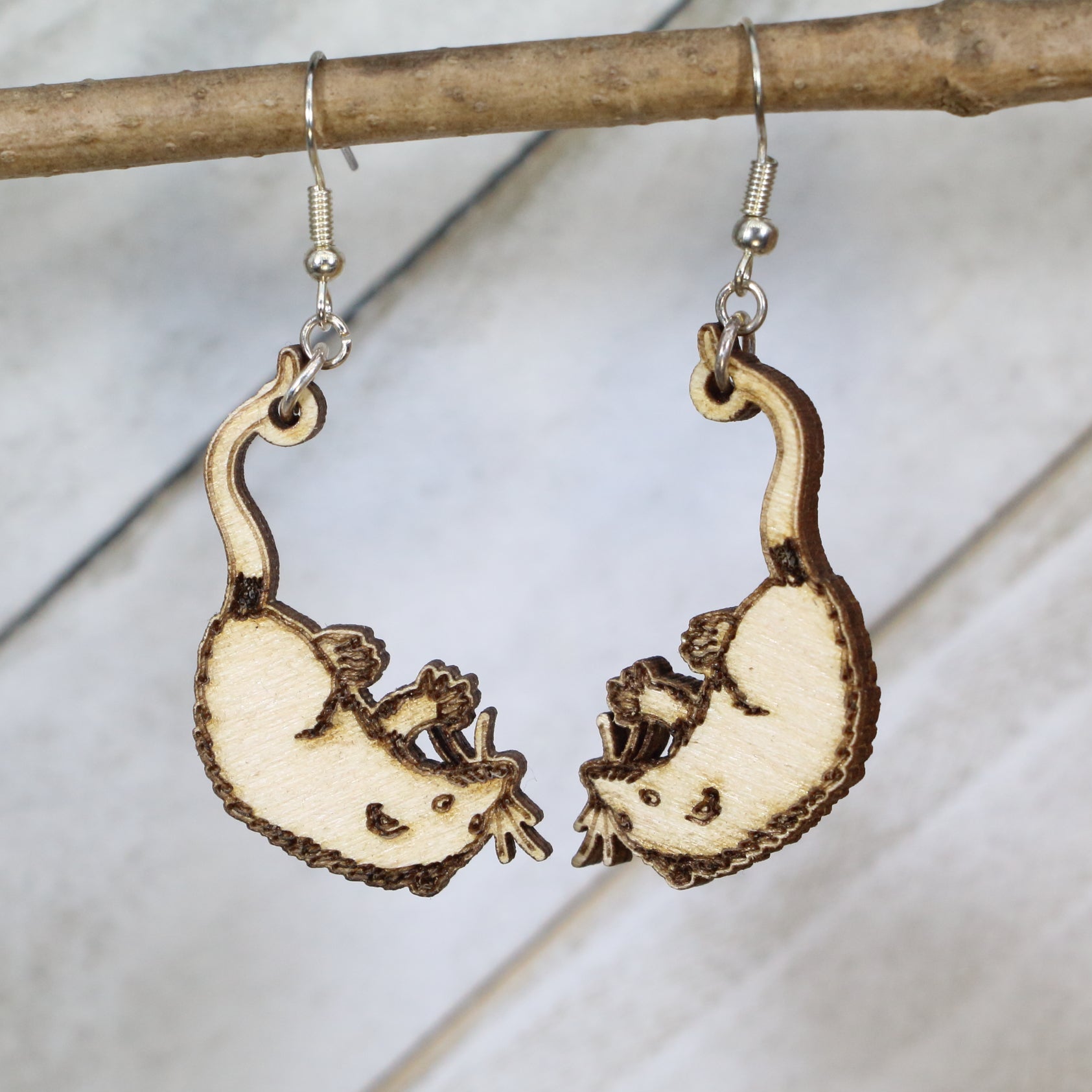 Hand-painted wooden opossum dangle earrings with cute woodland animal design and hypoallergenic sterling silver hooks, quirky nature lover animal jewelry earrings