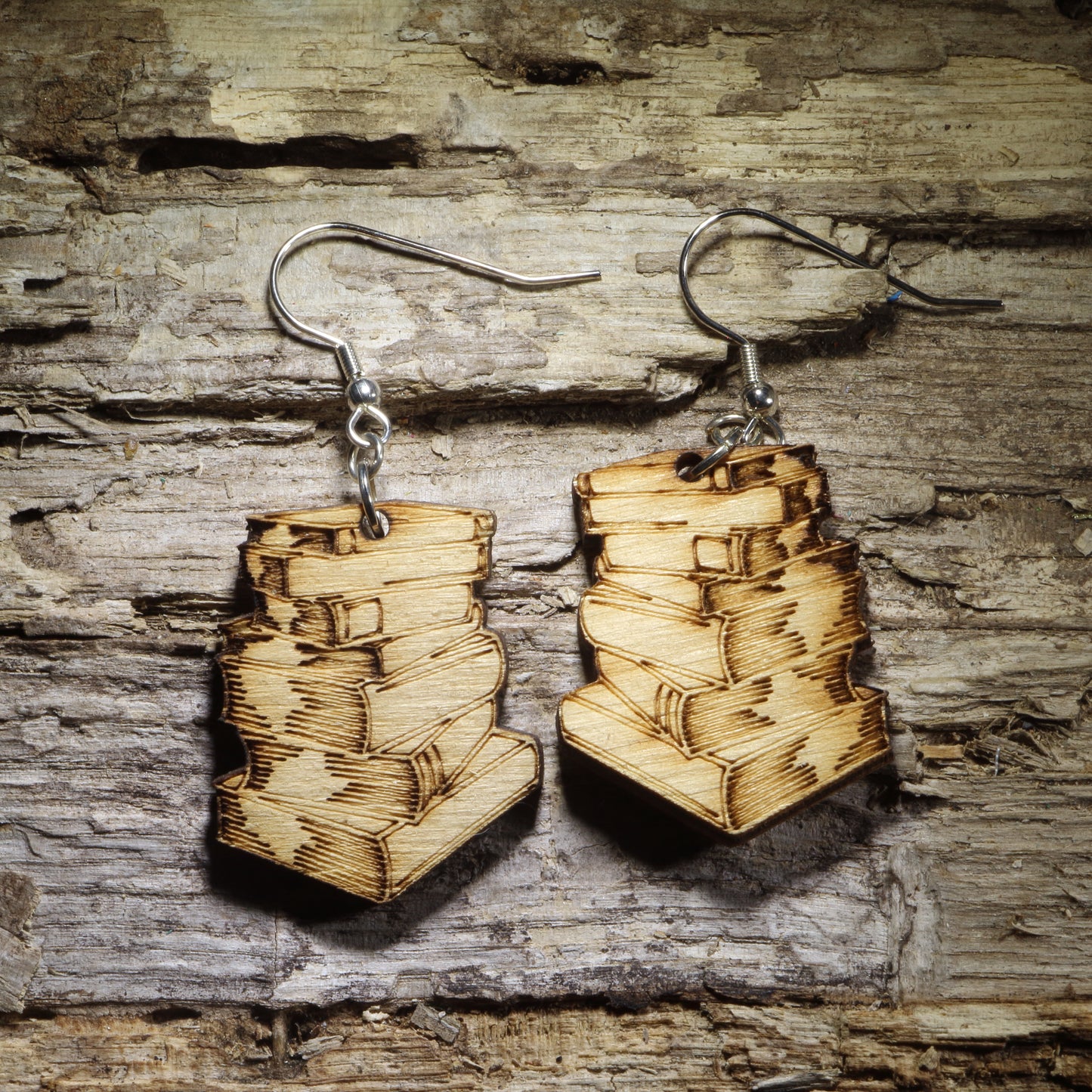 Pair of natural wood stacked book dangle earrings featuring detailed engraved vintage books, perfect for readers, librarians, teachers, and book lovers