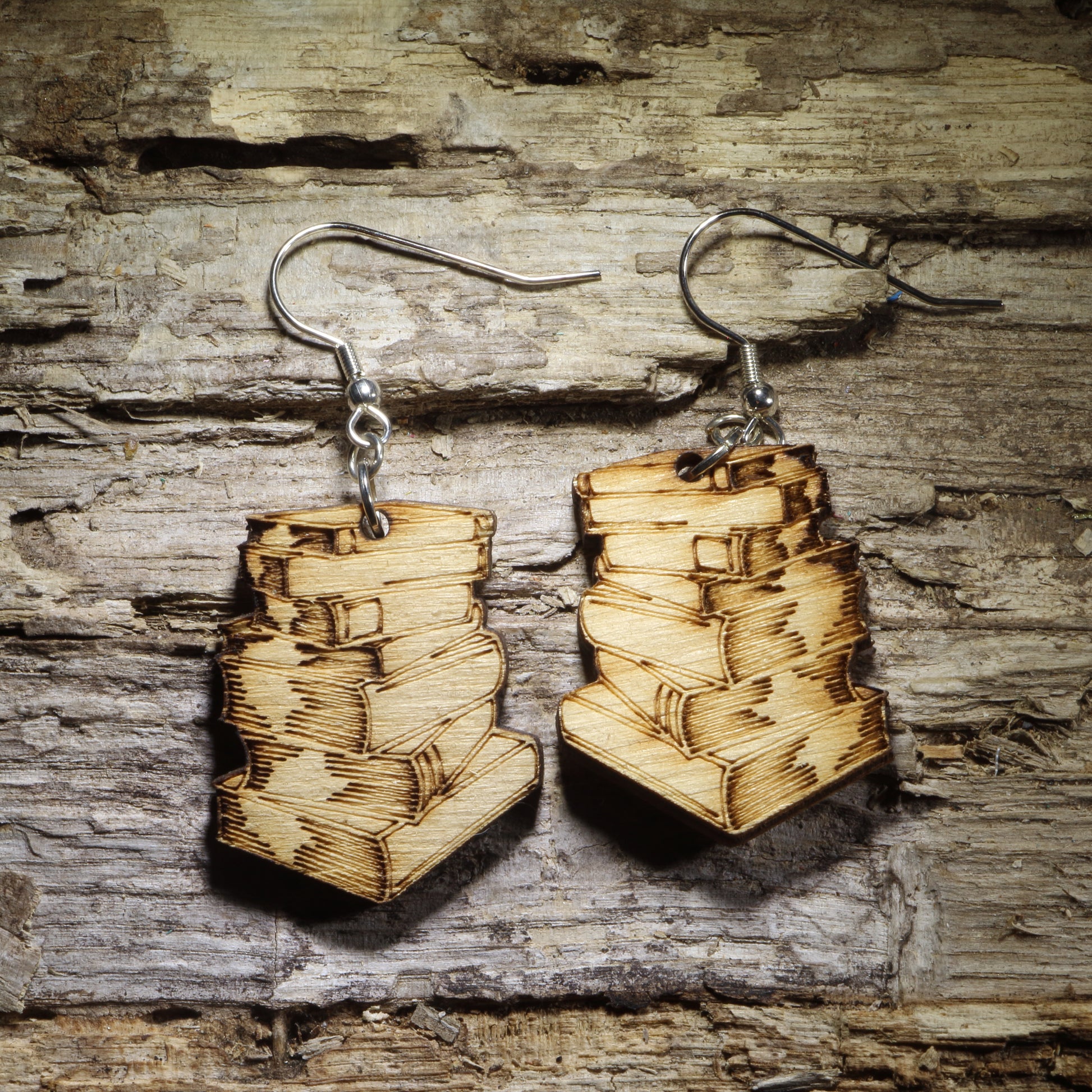 Pair of natural wood stacked book dangle earrings featuring detailed engraved vintage books, perfect for readers, librarians, teachers, and book lovers