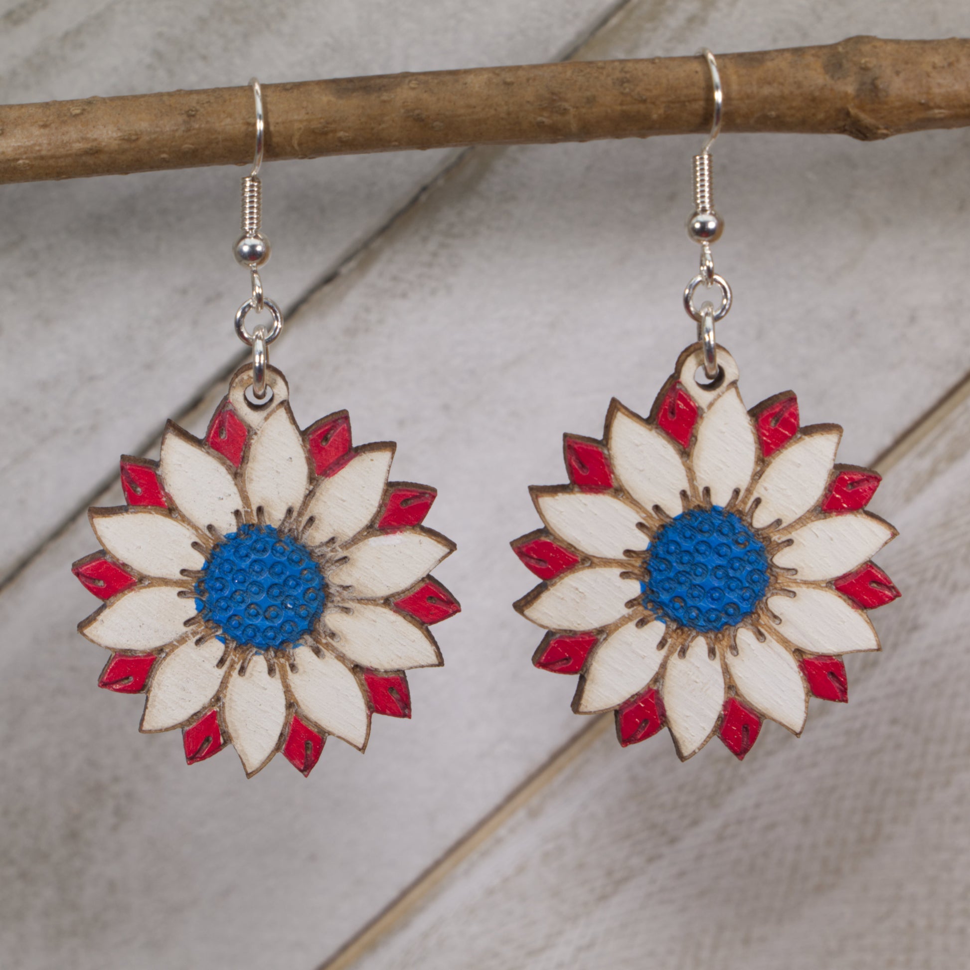 Hand-painted wooden patriotic sunflower dangle earrings with red white blue floral design and hypoallergenic sterling silver hooks, Americana patriotic flower jewelry earrings