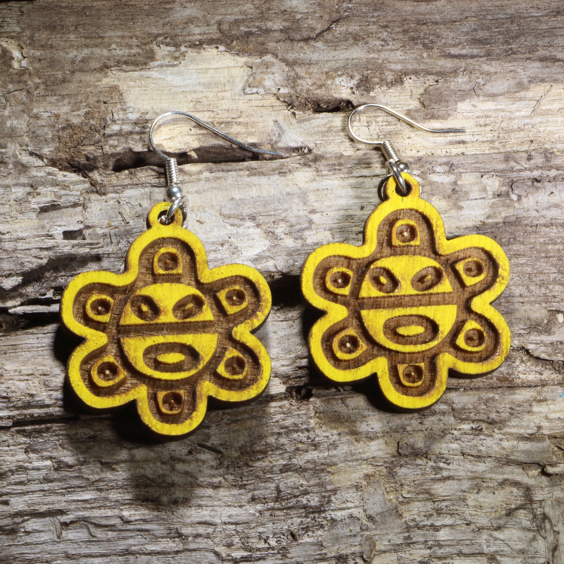 Hand-painted wooden Puerto Rican Taíno sun symbol dangle earrings featuring the iconic yellow Taíno sun on hypoallergenic .925 sterling silver hooks. Lightweight Puerto Rico-inspired jewelry for Boricua pride, Caribbean culture, Taíno heritage, island travelers, and unique cultural gifts.