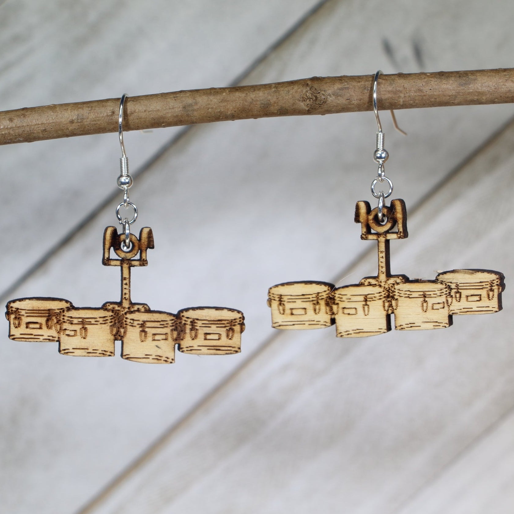 Hand-painted wooden quad drum dangle earrings featuring a marching tenor drum set design with multiple drums and hardware detail and hypoallergenic sterling silver hooks, lightweight jewelry for marching band members and percussionists