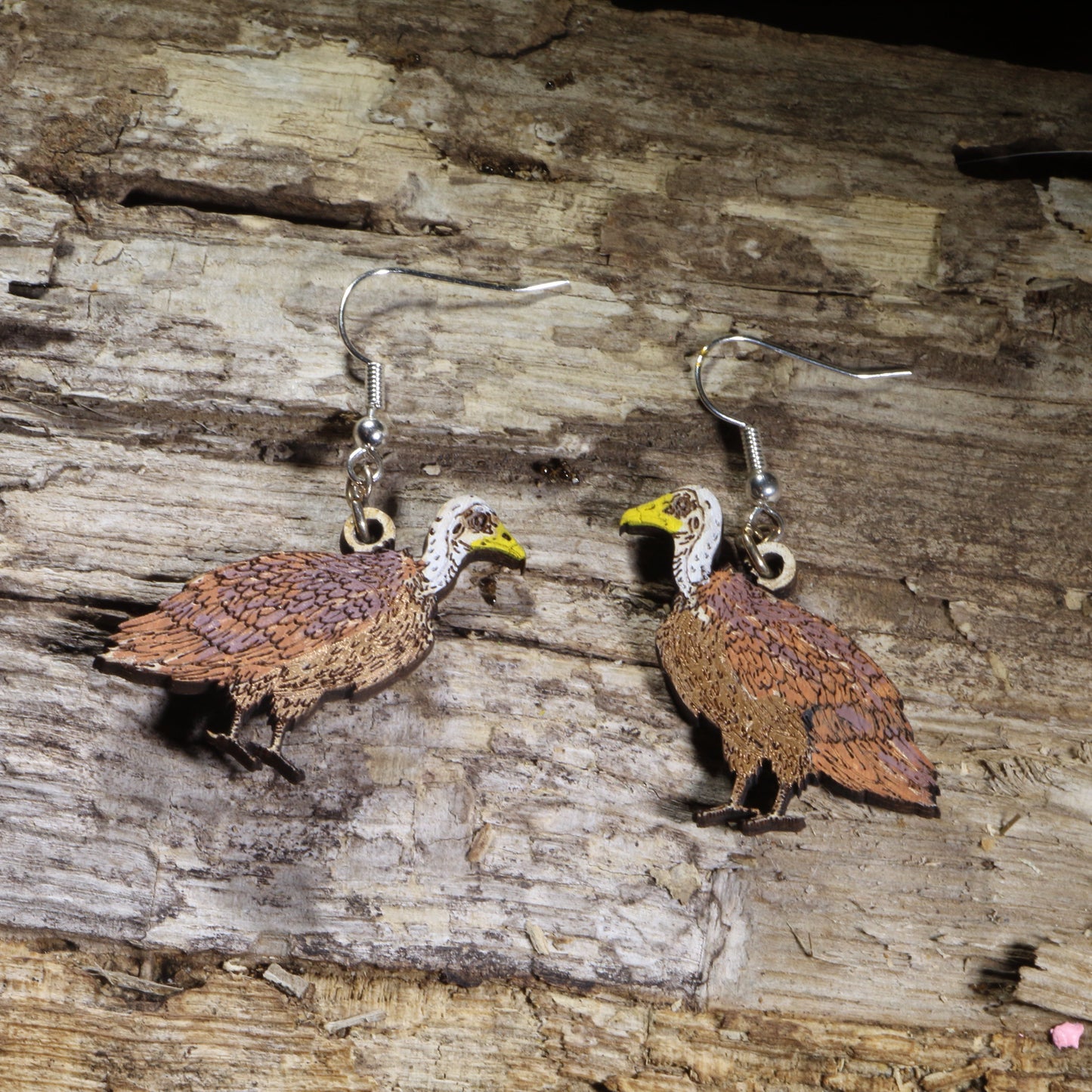 Hand-painted Rüppell's vulture wooden dangle earrings on hypoallergenic .925 sterling silver hooks. Lightweight bird of prey wildlife jewelry for birdwatchers, ornithologists, raptor enthusiasts, conservation supporters, and nature lovers.