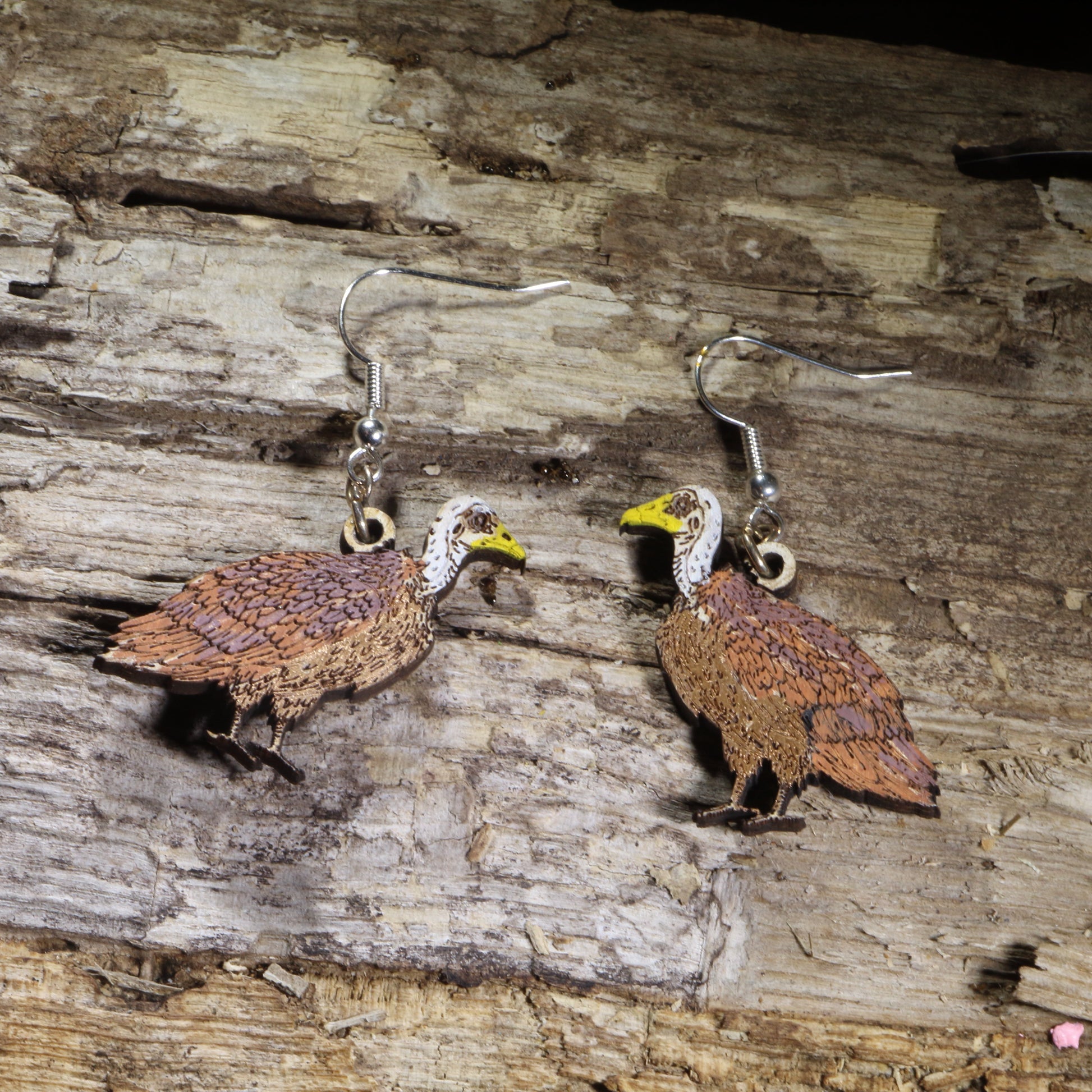 Hand-painted Rüppell's vulture wooden dangle earrings on hypoallergenic .925 sterling silver hooks. Lightweight bird of prey wildlife jewelry for birdwatchers, ornithologists, raptor enthusiasts, conservation supporters, and nature lovers.