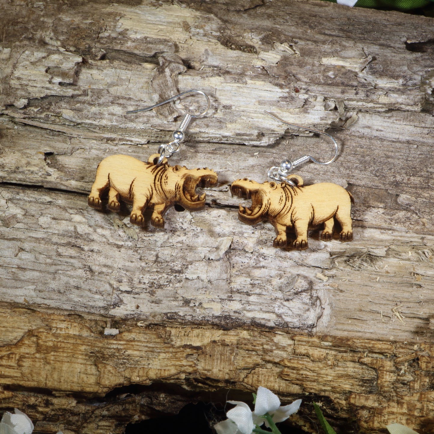 Hand-painted wooden hippopotamus dangle earrings featuring realistic hippo artwork with open mouths, hypoallergenic sterling silver hooks, and lightweight wildlife animal jewelry for zoo lovers, safari enthusiasts, and hippo fans by Cate's Concepts.