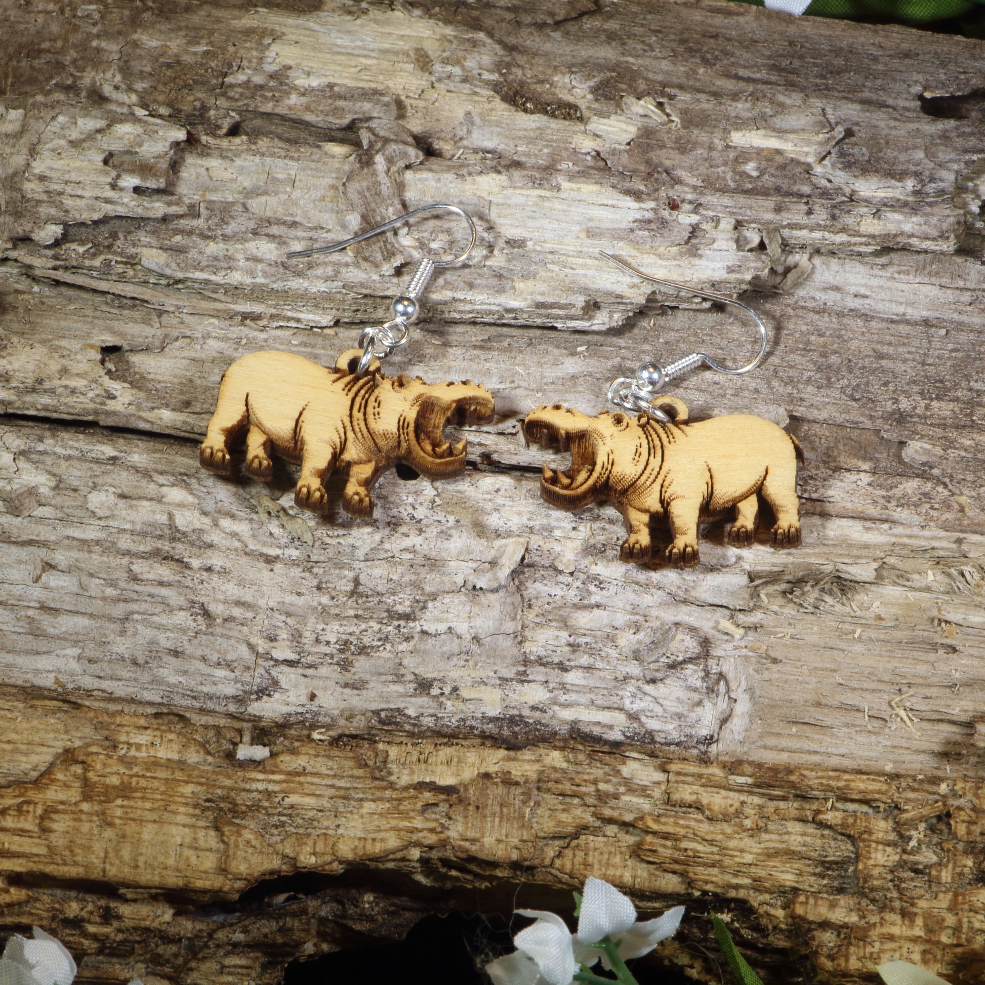 Hand-painted wooden hippopotamus dangle earrings featuring realistic hippo artwork with open mouths, hypoallergenic sterling silver hooks, and lightweight wildlife animal jewelry for zoo lovers, safari enthusiasts, and hippo fans by Cate's Concepts.