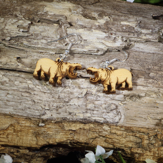 Hand-painted wooden hippopotamus dangle earrings featuring realistic hippo artwork with open mouths, hypoallergenic sterling silver hooks, and lightweight wildlife animal jewelry for zoo lovers, safari enthusiasts, and hippo fans by Cate's Concepts.