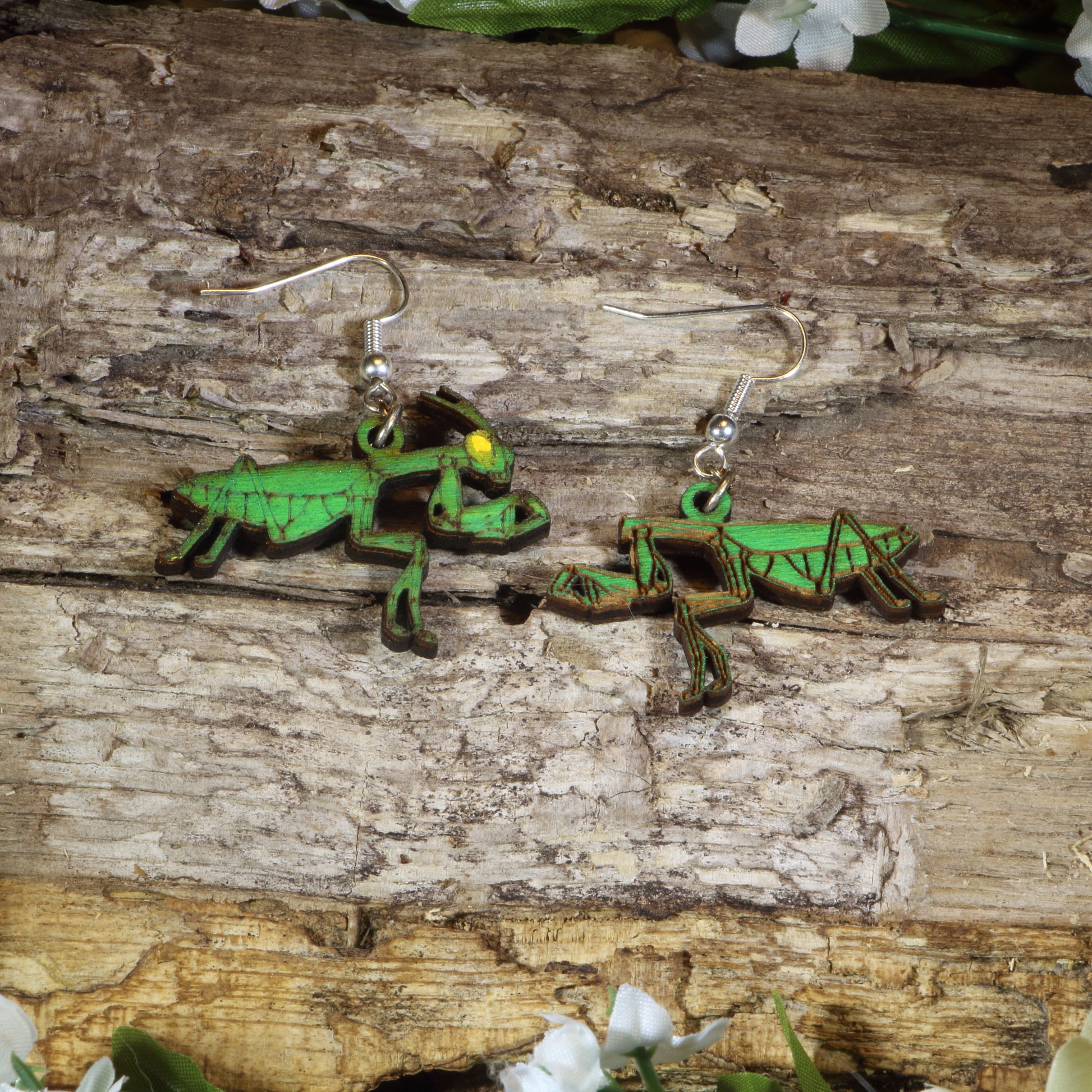 Hand-painted wooden praying mantis dangle earrings featuring realistic green mantis artwork, hypoallergenic sterling silver hooks, and lightweight insect jewelry for bug lovers, entomologists, and nature enthusiasts by Cate's Concepts.