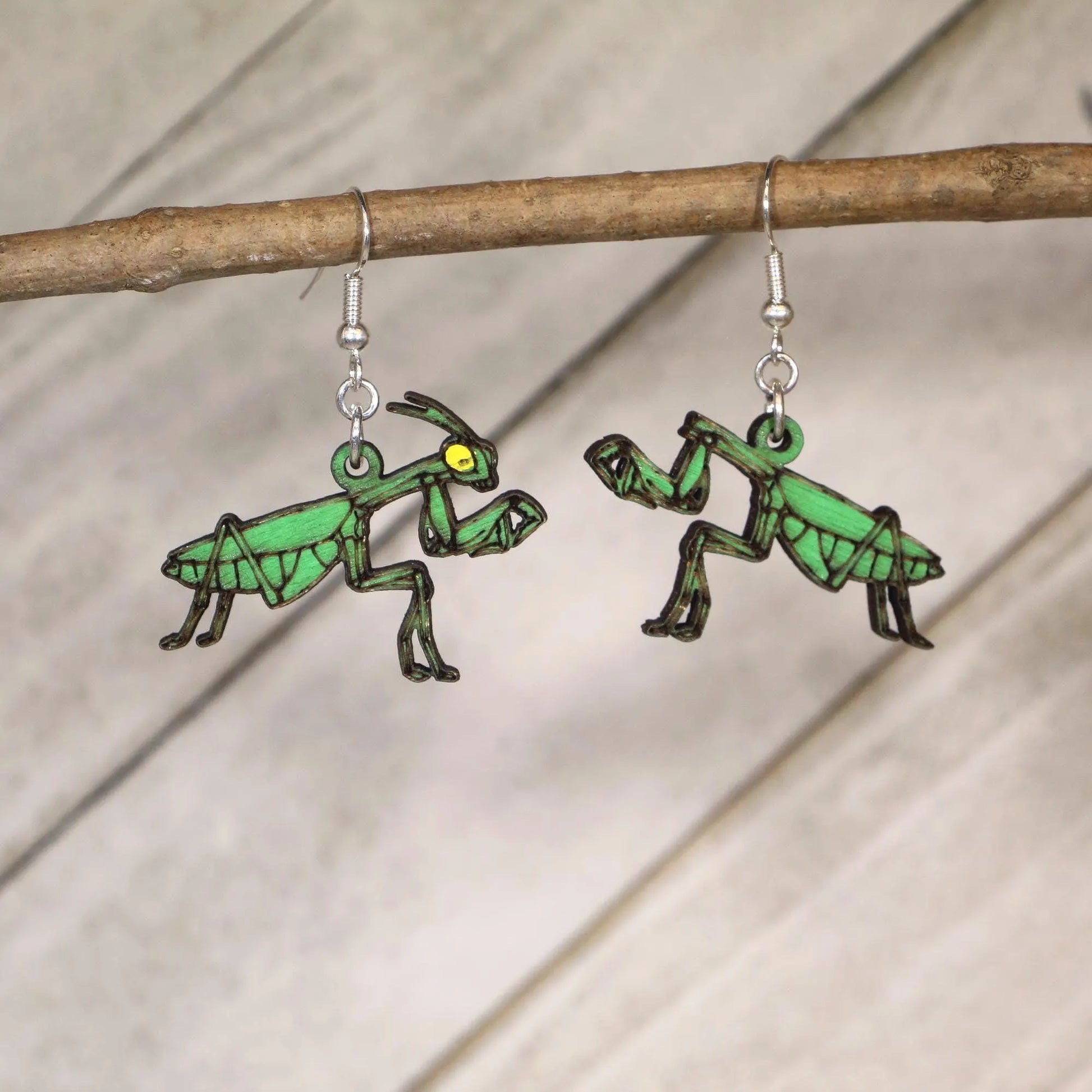 Hand-painted wooden praying mantis dangle earrings featuring realistic male and female mantis design with hypoallergenic sterling silver hooks, entomology insect jewelry gift for bug lovers