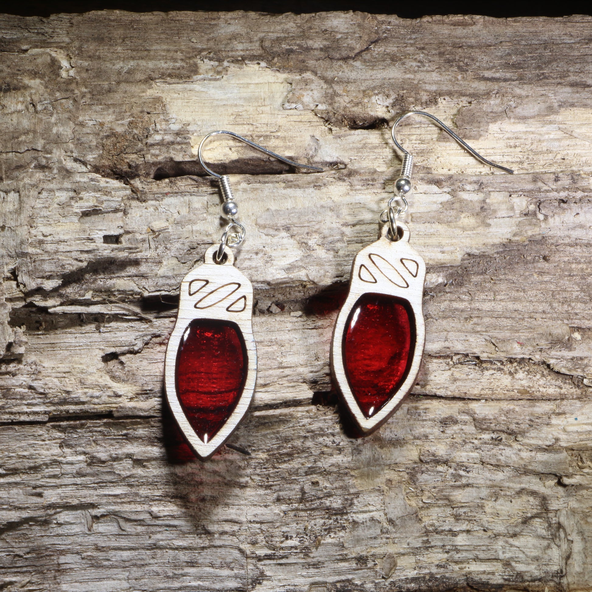 Handcrafted red resin Christmas light wooden dangle earrings featuring colorful holiday light bulbs with glossy resin-filled centers. Lightweight laser-cut wooden earrings with hypoallergenic .925 sterling silver hooks, perfect for Christmas celebrations, holiday parties, festive fashion, Christmas light lovers, and seasonal handmade jewelry.