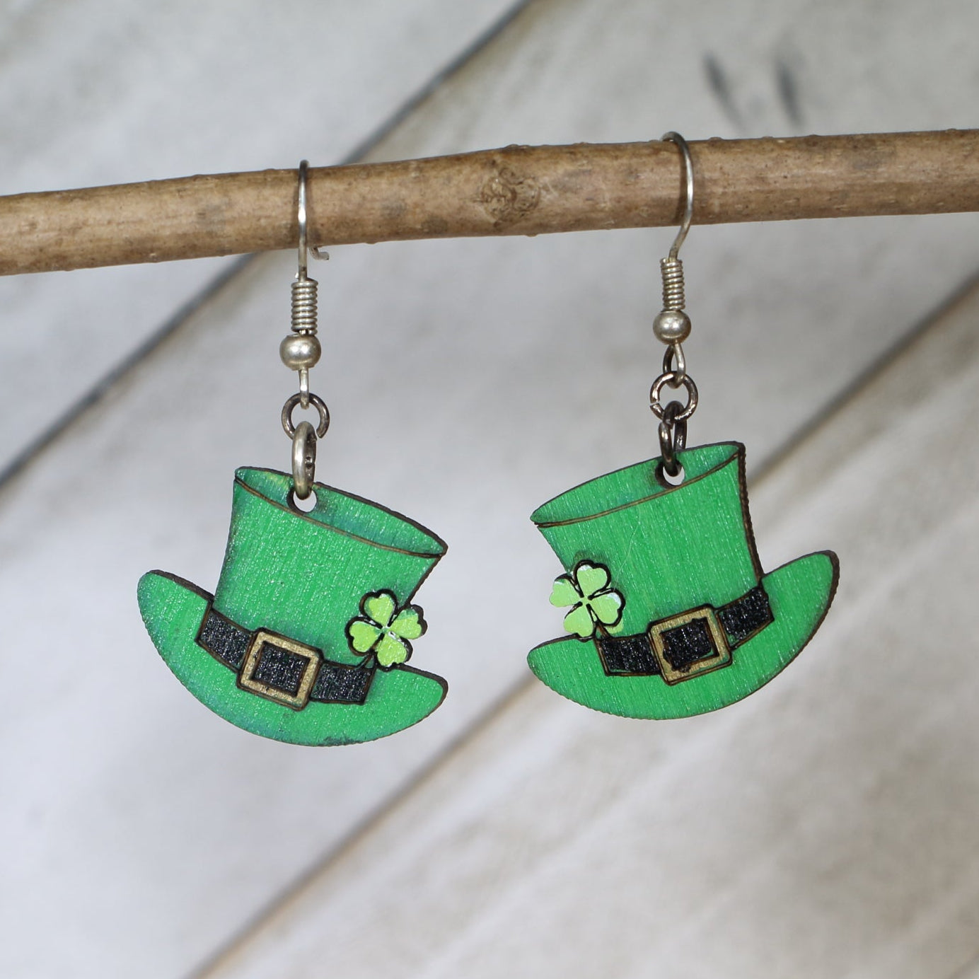 Hand-painted wooden shamrock hat dangle earrings featuring a festive green hat with clover design and lucky details and hypoallergenic sterling silver hooks, lightweight jewelry for St Patrick’s Day celebrations and Irish pride by Cate’s Concepts