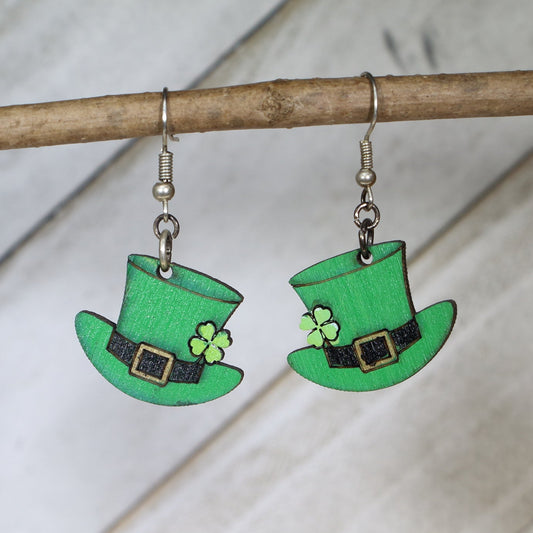 Hand-painted wooden shamrock hat dangle earrings featuring a festive green hat with clover design and lucky details and hypoallergenic sterling silver hooks, lightweight jewelry for St Patrick’s Day celebrations and Irish pride by Cate’s Concepts