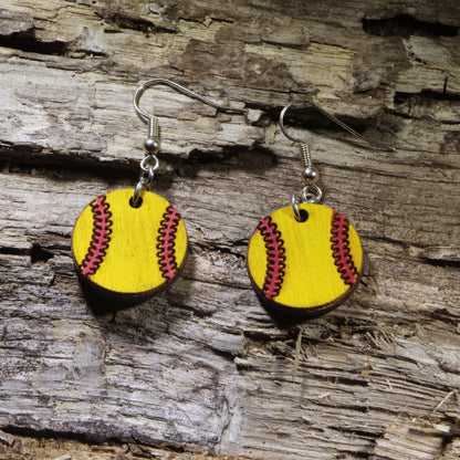 Hand-painted wooden softball dangle earrings featuring a classic yellow softball with bright red stitching. Lightweight sports earrings with hypoallergenic .925 sterling silver hooks, perfect for softball players, coaches, team moms, tournaments, game days, and celebrating a love of the sport.