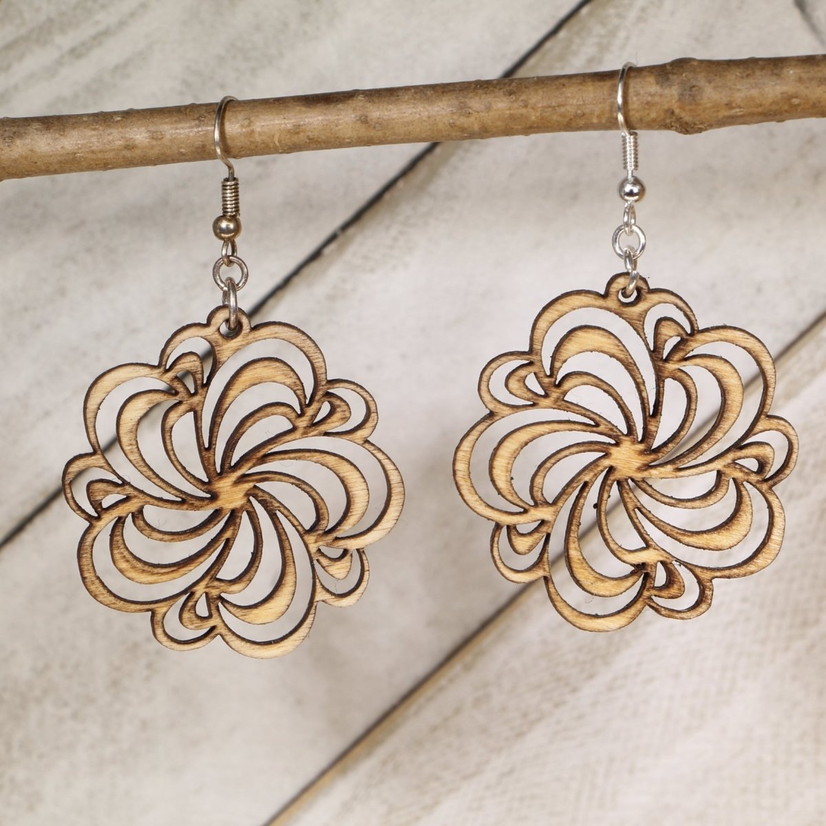 Hand-painted wooden swirl flower dangle earrings with boho floral cutout design and hypoallergenic sterling silver hooks, lightweight flower statement jewelry earrings for botanical and bohemian style