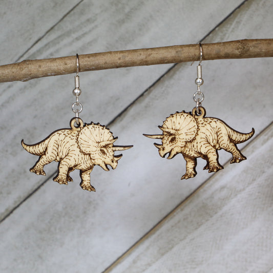 Hand-painted wooden triceratops dangle earrings with detailed dinosaur design and hypoallergenic sterling silver hooks, lightweight prehistoric dinosaur jewelry gift for dinosaur lovers