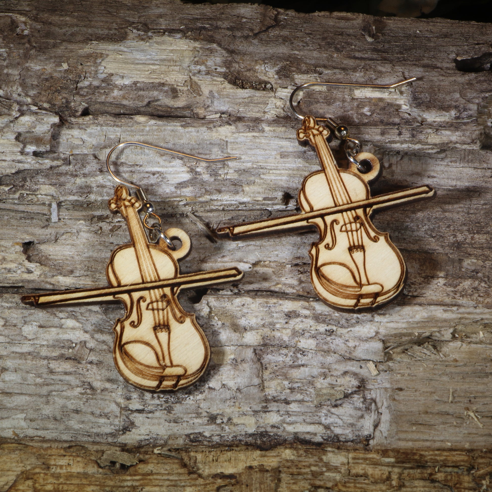 Hand-painted wooden violin dangle earrings featuring detailed violin instrument artwork, hypoallergenic sterling silver hooks, and lightweight musician jewelry for violinists, orchestra members, string musicians, and classical music lovers by Cate's Concepts.