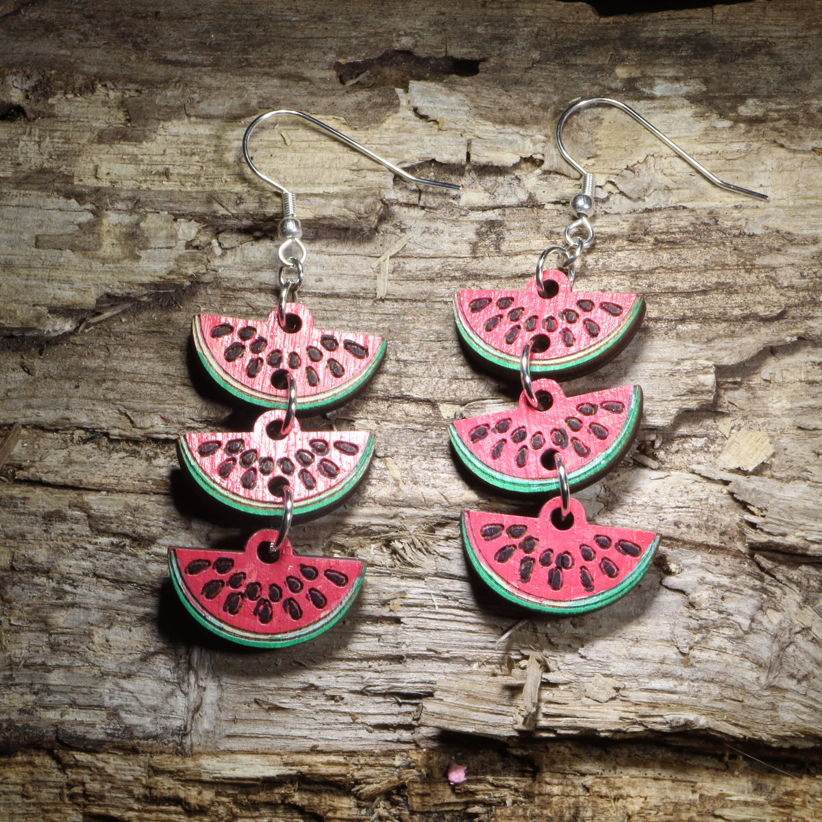 Watermelon slice chain wooden dangle earrings featuring three connected hand-painted watermelon wedges with bright red fruit, green rinds, and black seed details. Lightweight summer fruit earrings with hypoallergenic .925 sterling silver hooks, perfect for watermelon lovers, summer outfits, picnics, farmers markets, and fun food-themed jewelry.