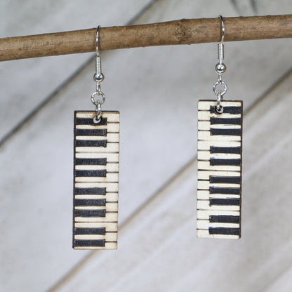 Hand-painted wooden wide piano key dangle earrings featuring a bold keyboard design with contrasting black and white keys and hypoallergenic sterling silver hooks, lightweight jewelry for pianists and music lovers by Cate’s Concepts